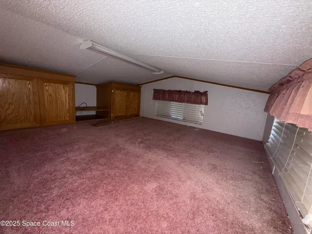 a view of a room with stairs