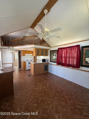 a view of a livingroom with furniture and windows