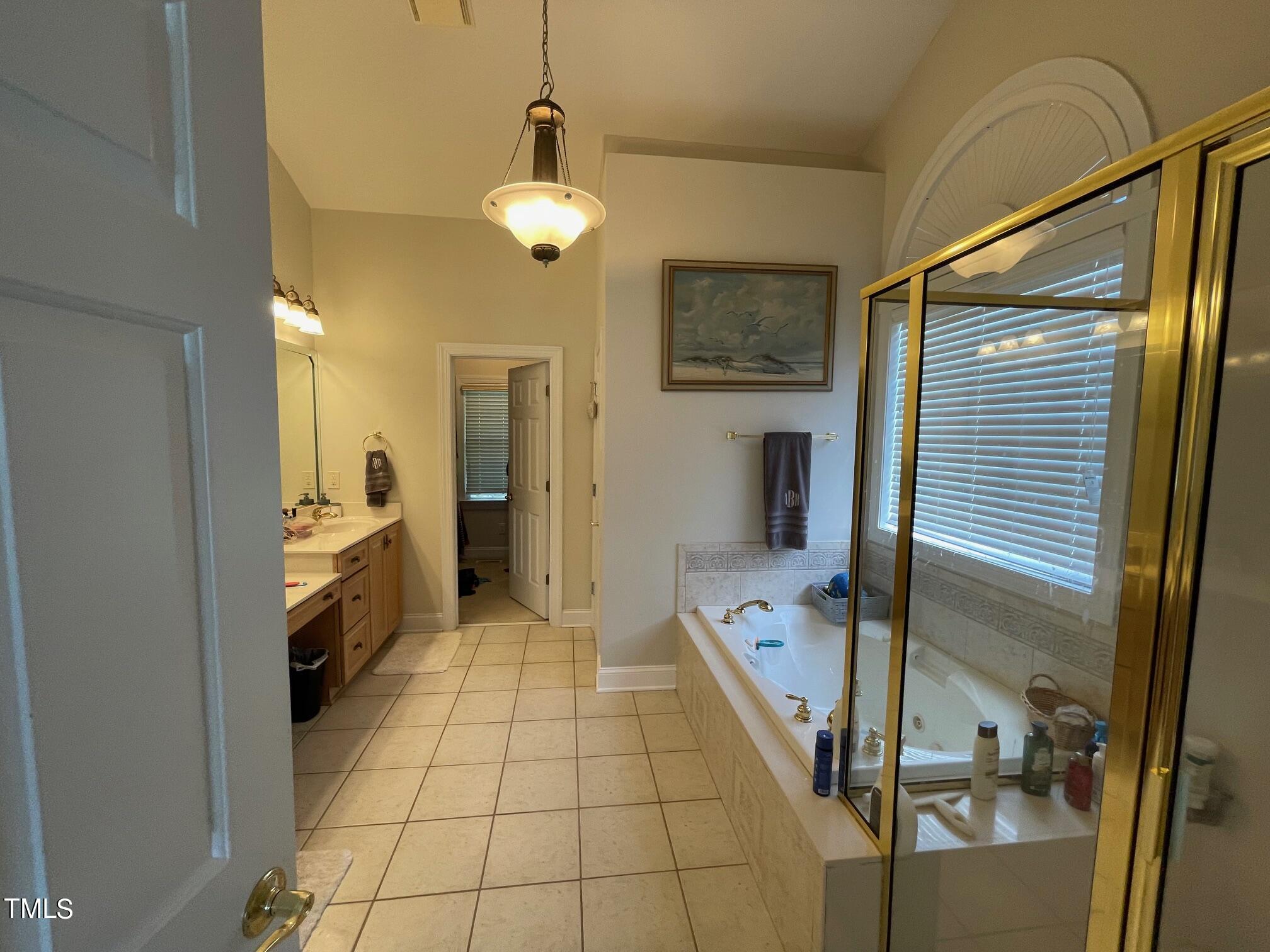 551 Competition Road Raleigh, NC 27603 - Photo 18 of 37 a bathroom with a sink and a mirror