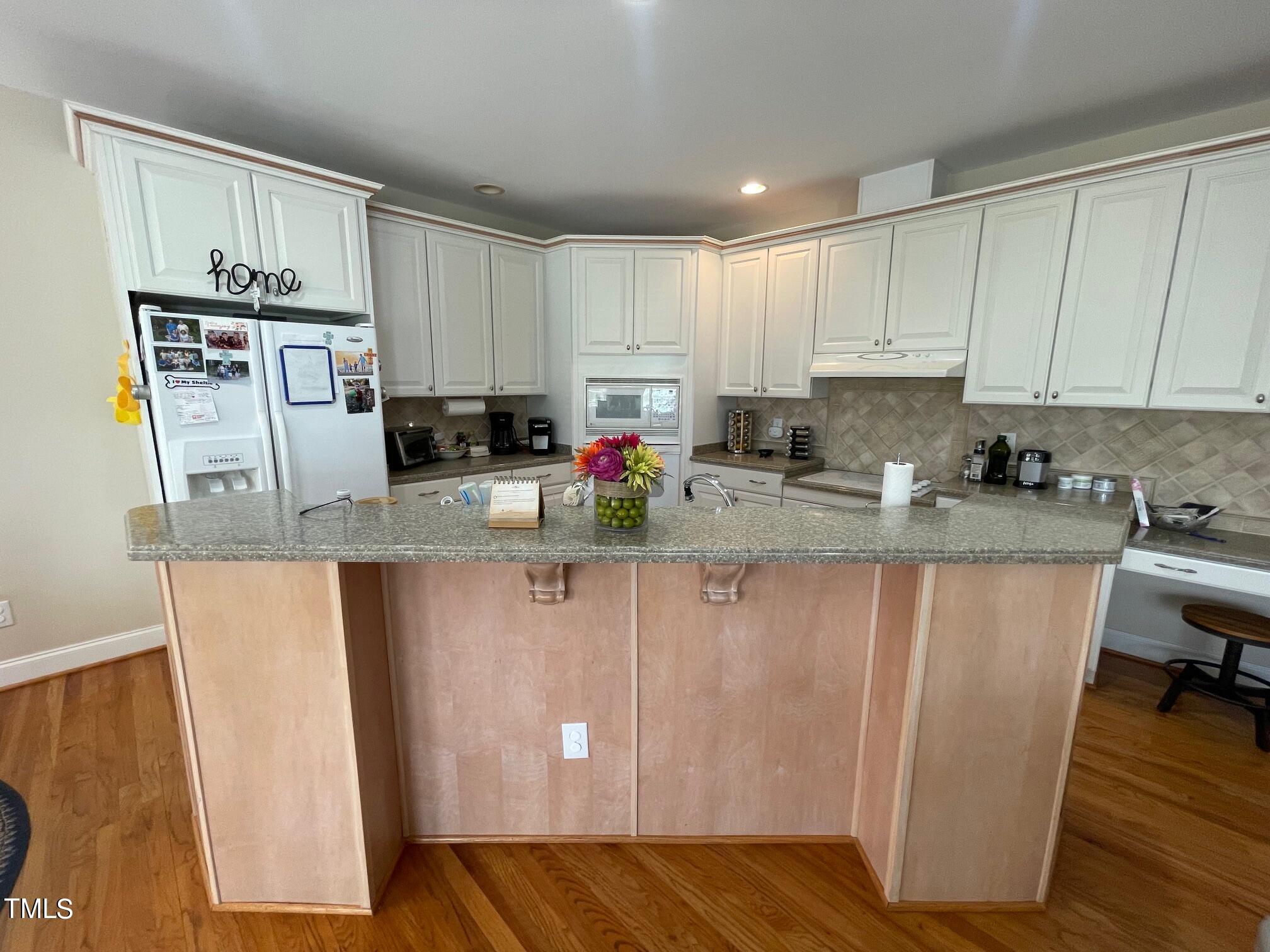 551 Competition Road Raleigh, NC 27603 - Photo 23 of 37 a kitchen with stainless steel appliances granite countertop a refrigerator sink and cabinets