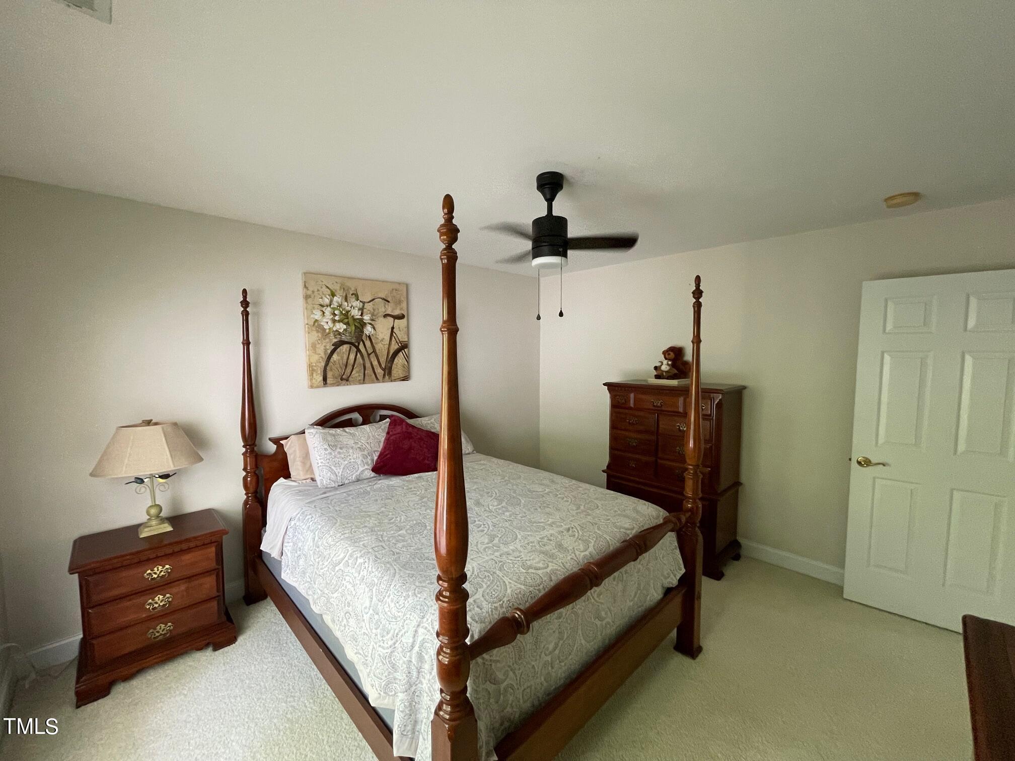 551 Competition Road Raleigh, NC 27603 - Photo 35 of 37 a bedroom with a bed and a table in it