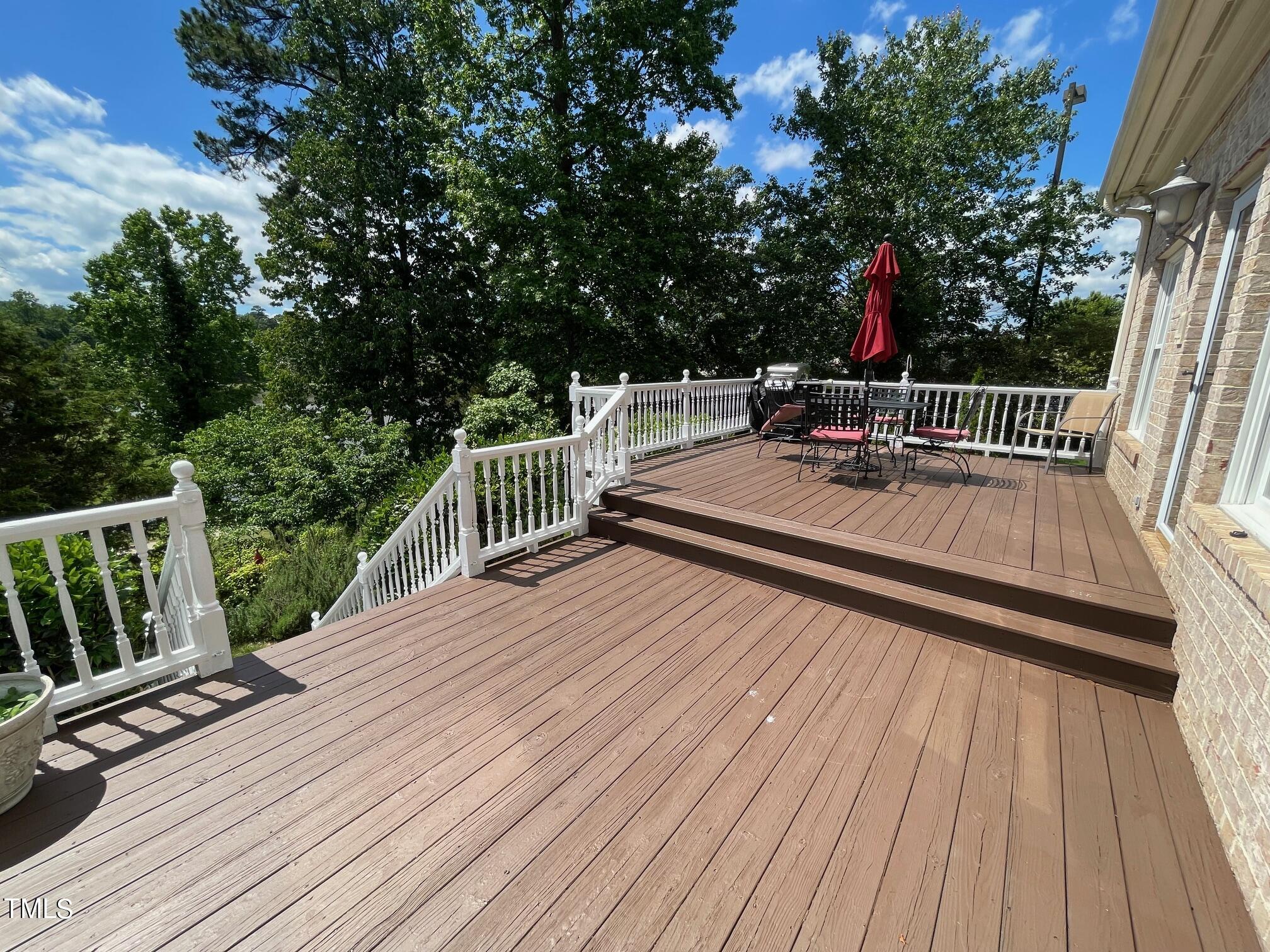 551 Competition Road Raleigh, NC 27603 - Photo 8 of 37 a view of balcony with deck and wooden floor