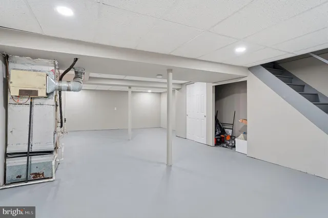 a view of storage and utility room with racks on the wall