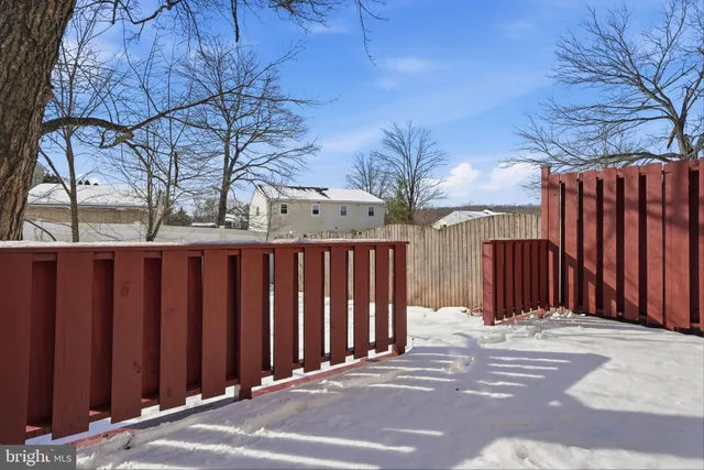 a front view of a house with iron fence