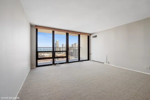 a view of an empty room with windows