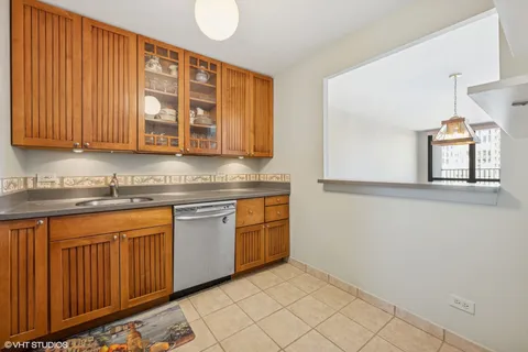 a kitchen with stainless steel appliances granite countertop a stove and a microwave