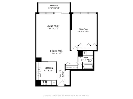 a kitchen with white cabinets and refrigerator