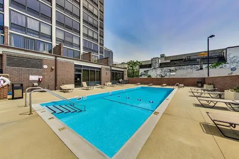 a view of a swimming pool with a lounge chairs