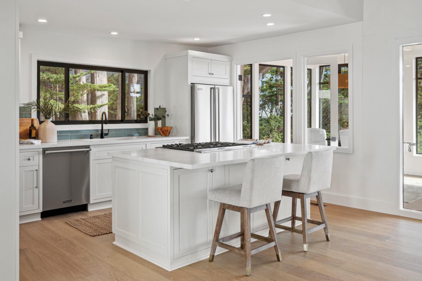 4171 Sunset Lane Pebble Beach, CA 93953 - Photo 13 of 38 a kitchen with center island table and chairs