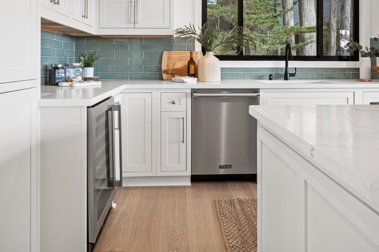 4171 Sunset Lane Pebble Beach, CA 93953 - Photo 15 of 38 a kitchen with a sink and cabinets