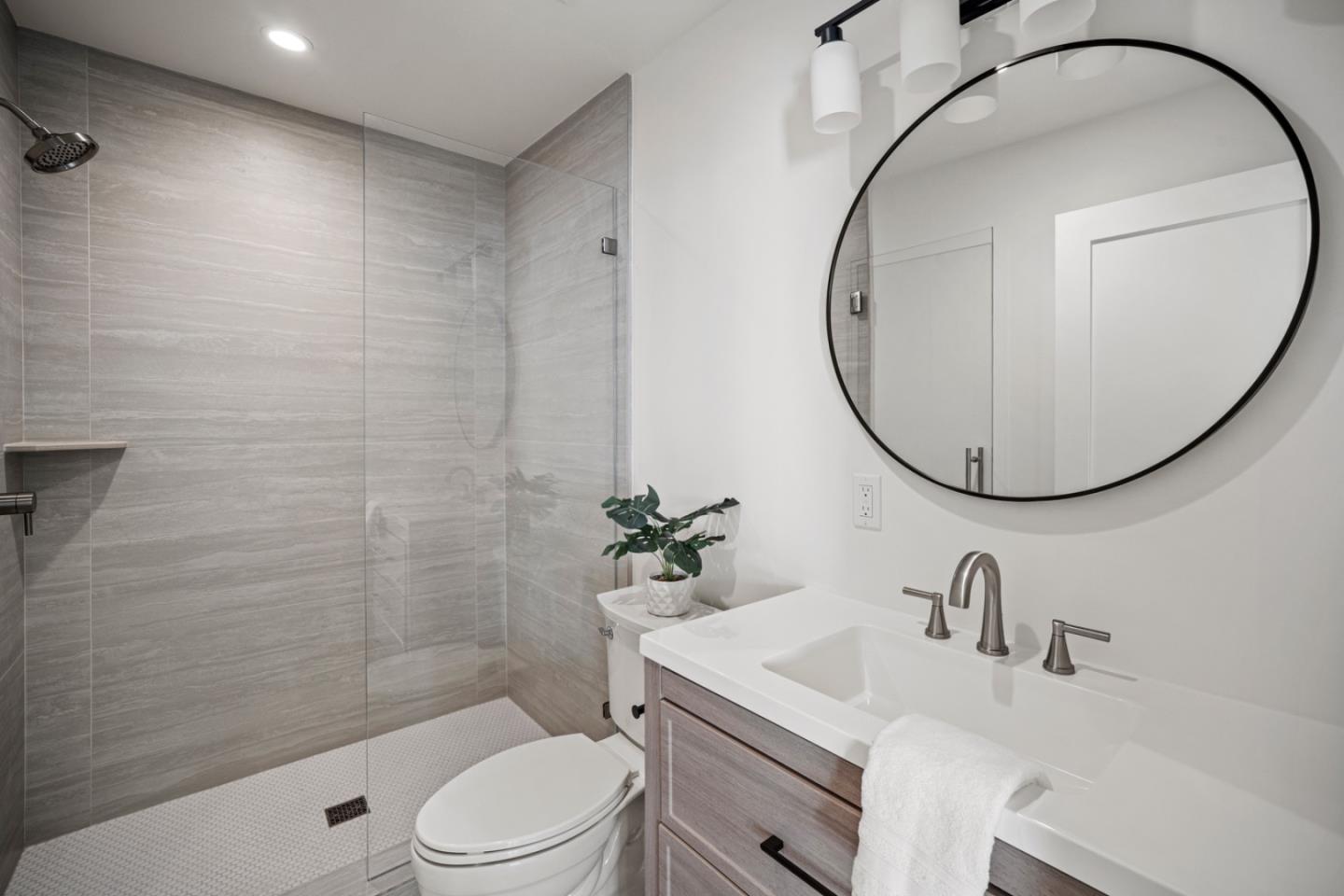 4171 Sunset Lane Pebble Beach, CA 93953 - Photo 27 of 38 a bathroom with a sink a toilet and a mirror