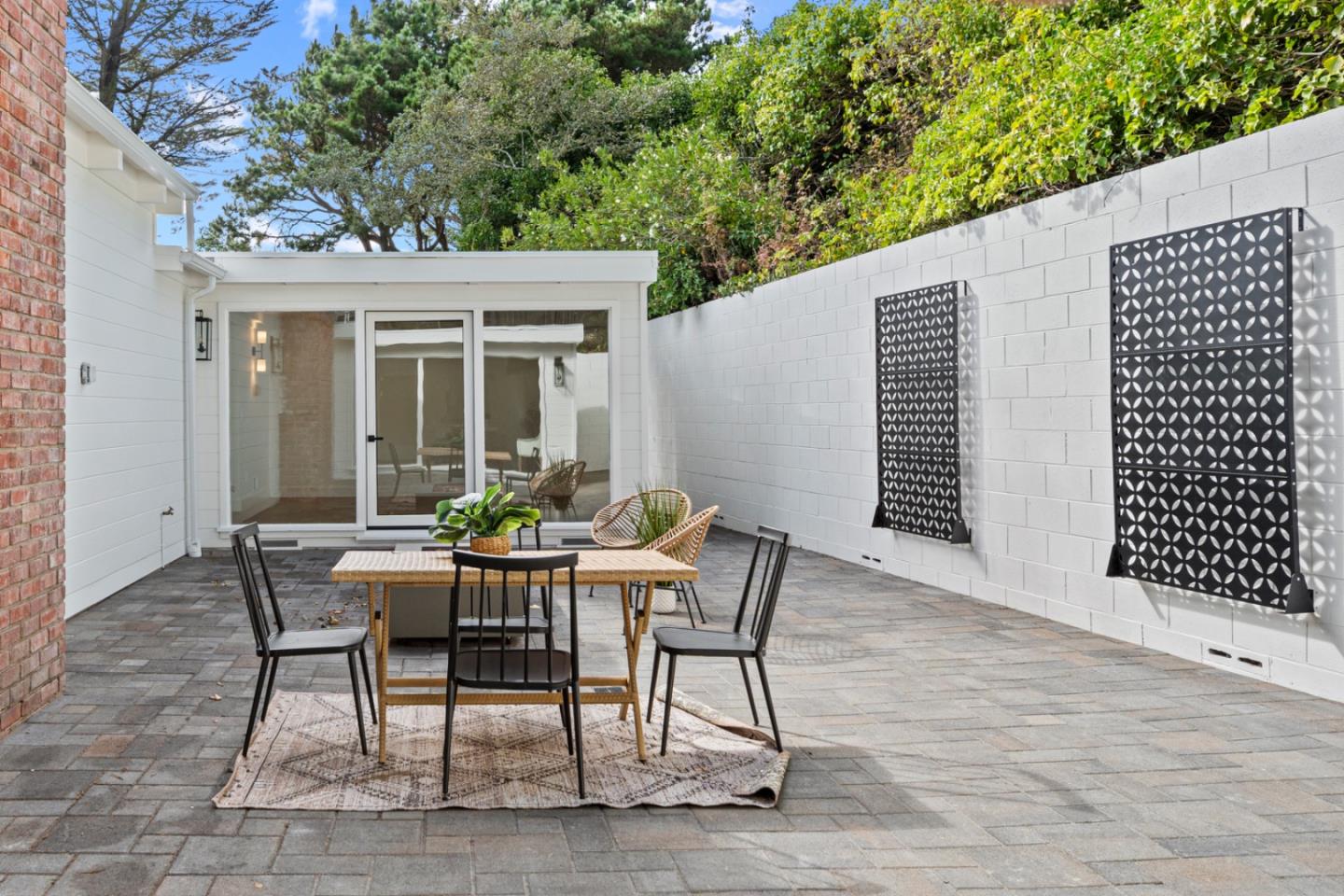 4171 Sunset Lane Pebble Beach, CA 93953 - Photo 33 of 38 a view of a patio with a table and chairs