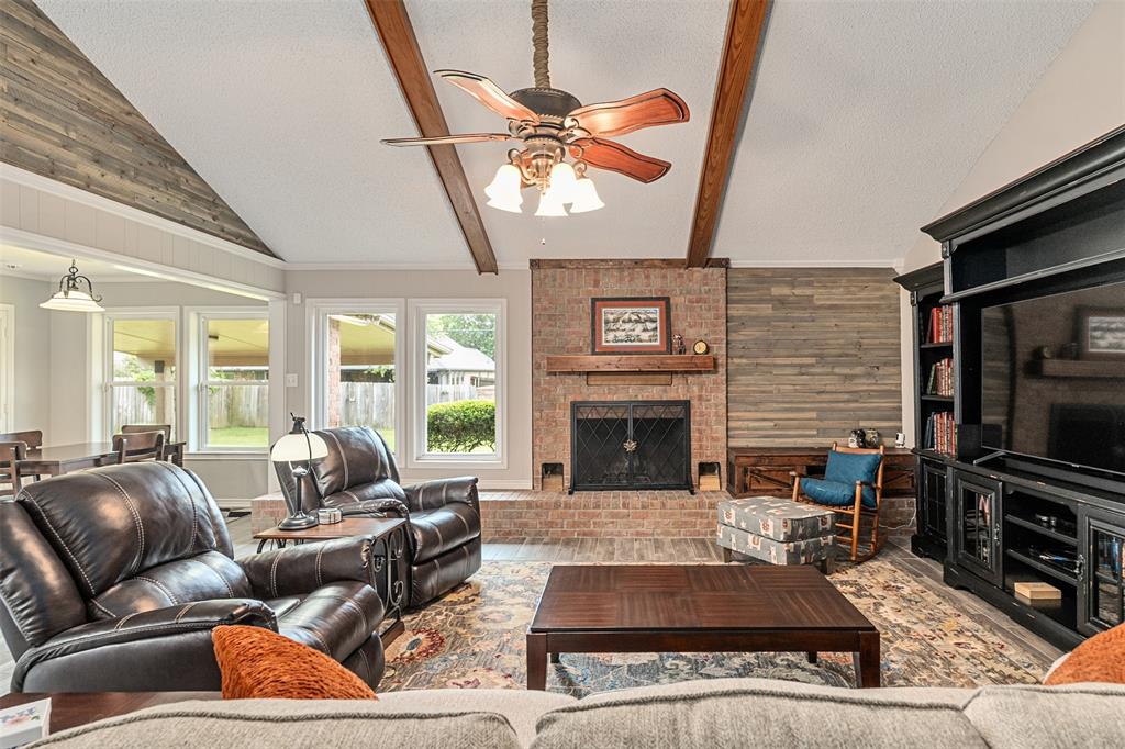 1102 Mill Run Road Athens, TX 75751 - Photo 8 of 35 a living room with furniture a fireplace and a flat screen tv