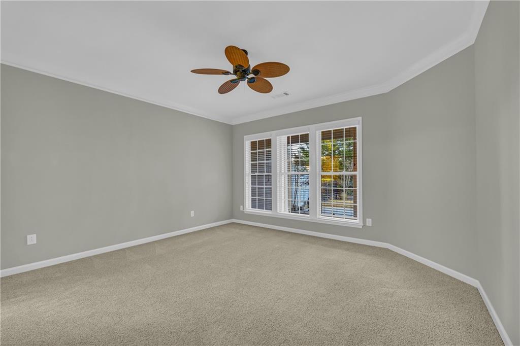 6116 Longleaf Drive Hoschton, GA 30548 - Photo 15 of 46 a view of an empty room with a window