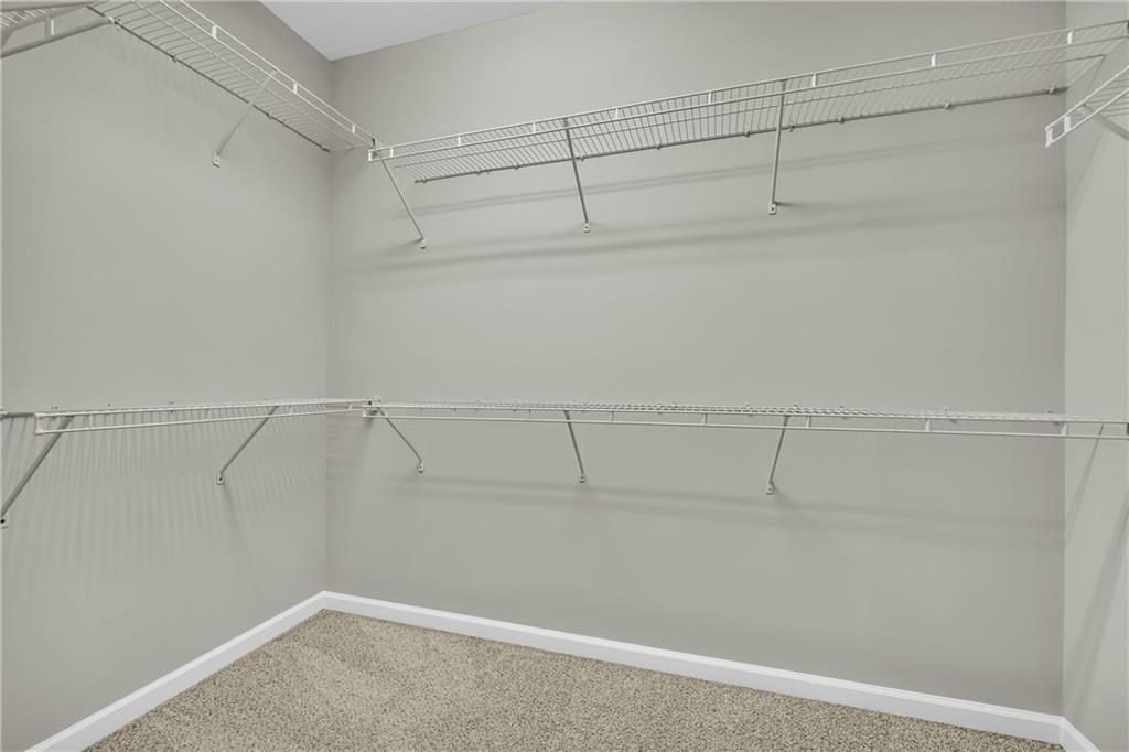 6116 Longleaf Drive Hoschton, GA 30548 - Photo 19 of 46 a view of a room with racks on the wall