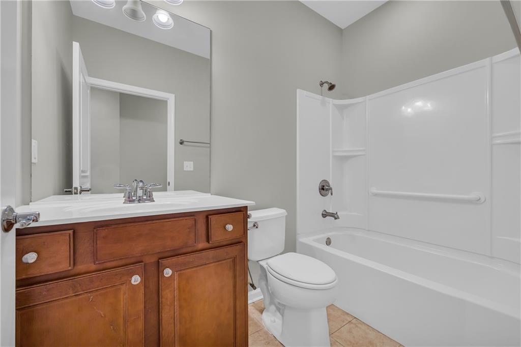 6116 Longleaf Drive Hoschton, GA 30548 - Photo 22 of 46 a bathroom with a sink a toilet and shower