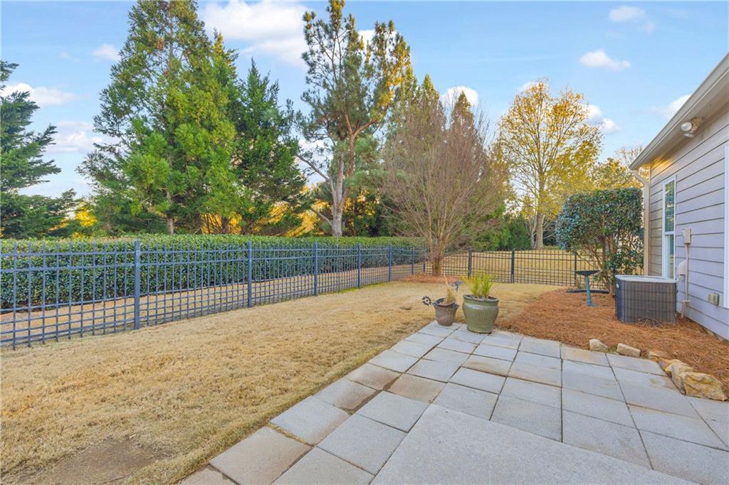 6116 Longleaf Drive Hoschton, GA 30548 - Photo 26 of 46 a view of backyard and trees