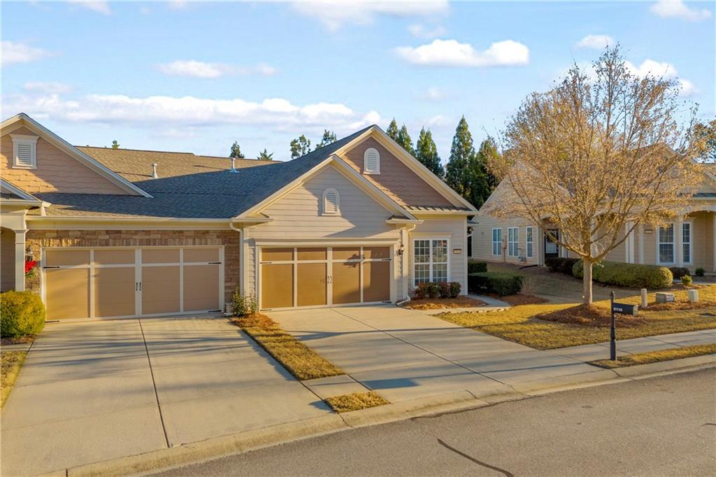 6116 Longleaf Drive Hoschton, GA 30548 - Photo 3 of 46 a front view of a house with a outdoor space