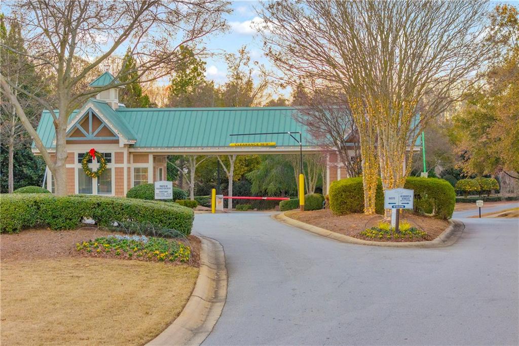6116 Longleaf Drive Hoschton, GA 30548 - Photo 36 of 46 a front view of a house with a yard and garage