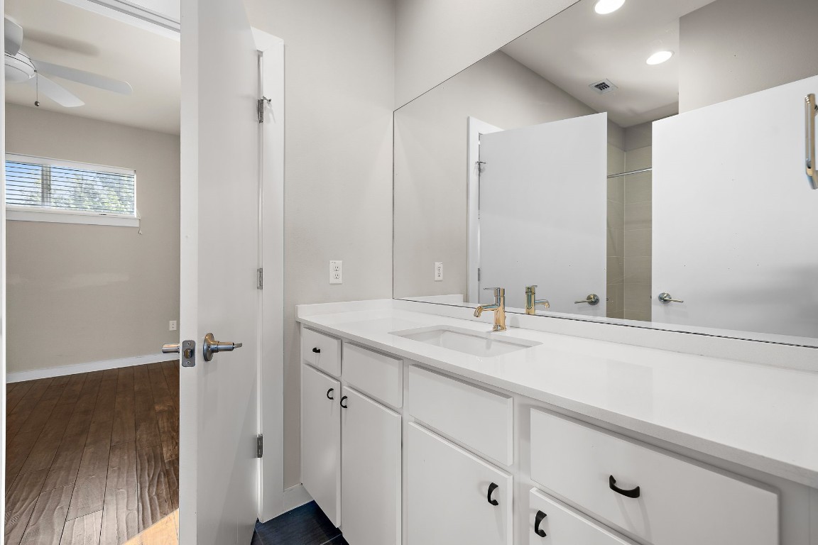5616 South 1st Street, Unit 31 Austin, TX 78745 - Photo 16 of 21 a bathroom with a sink and a mirror