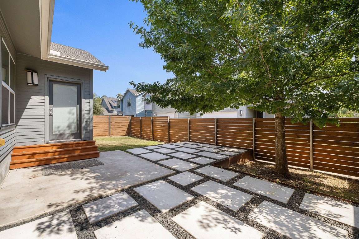 5616 South 1st Street, Unit 31 Austin, TX 78745 - Photo 19 of 21 a view of a yard with plants and trees