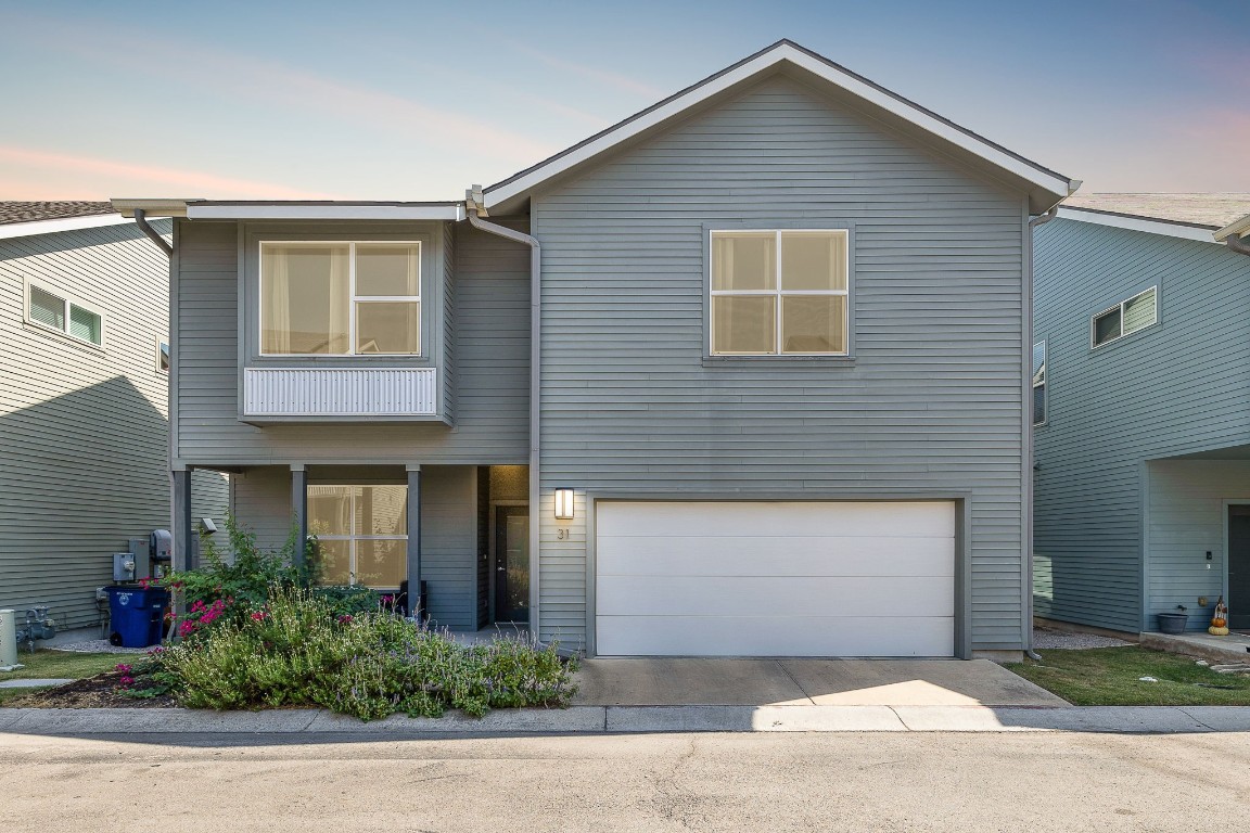 5616 South 1st Street, Unit 31 Austin, TX 78745 - Photo 2 of 21 a front view of house with yard