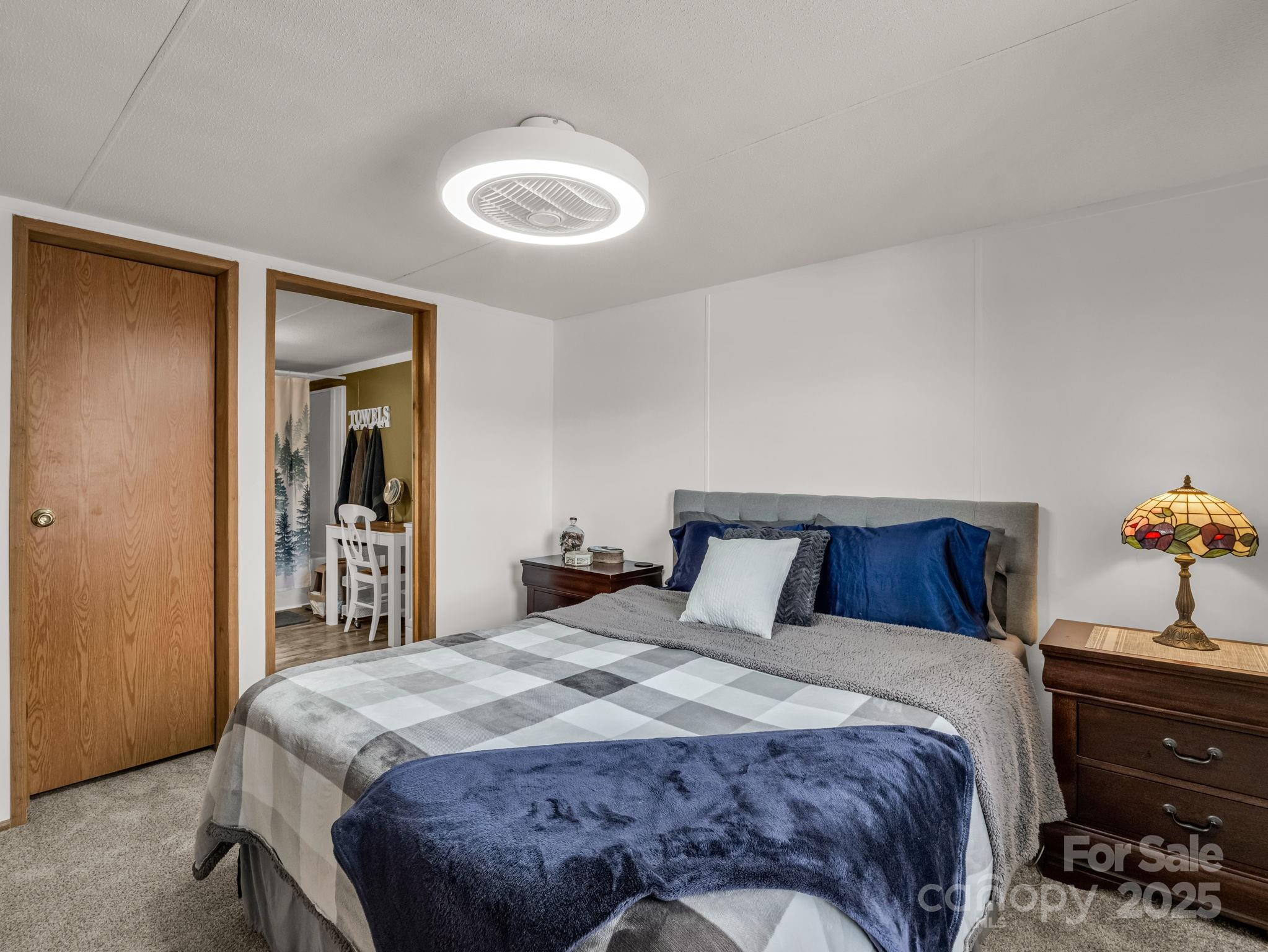 106 Hazy Day Swannanoa, NC 28778 - Photo 11 of 30 a bedroom with a bed and a dresser