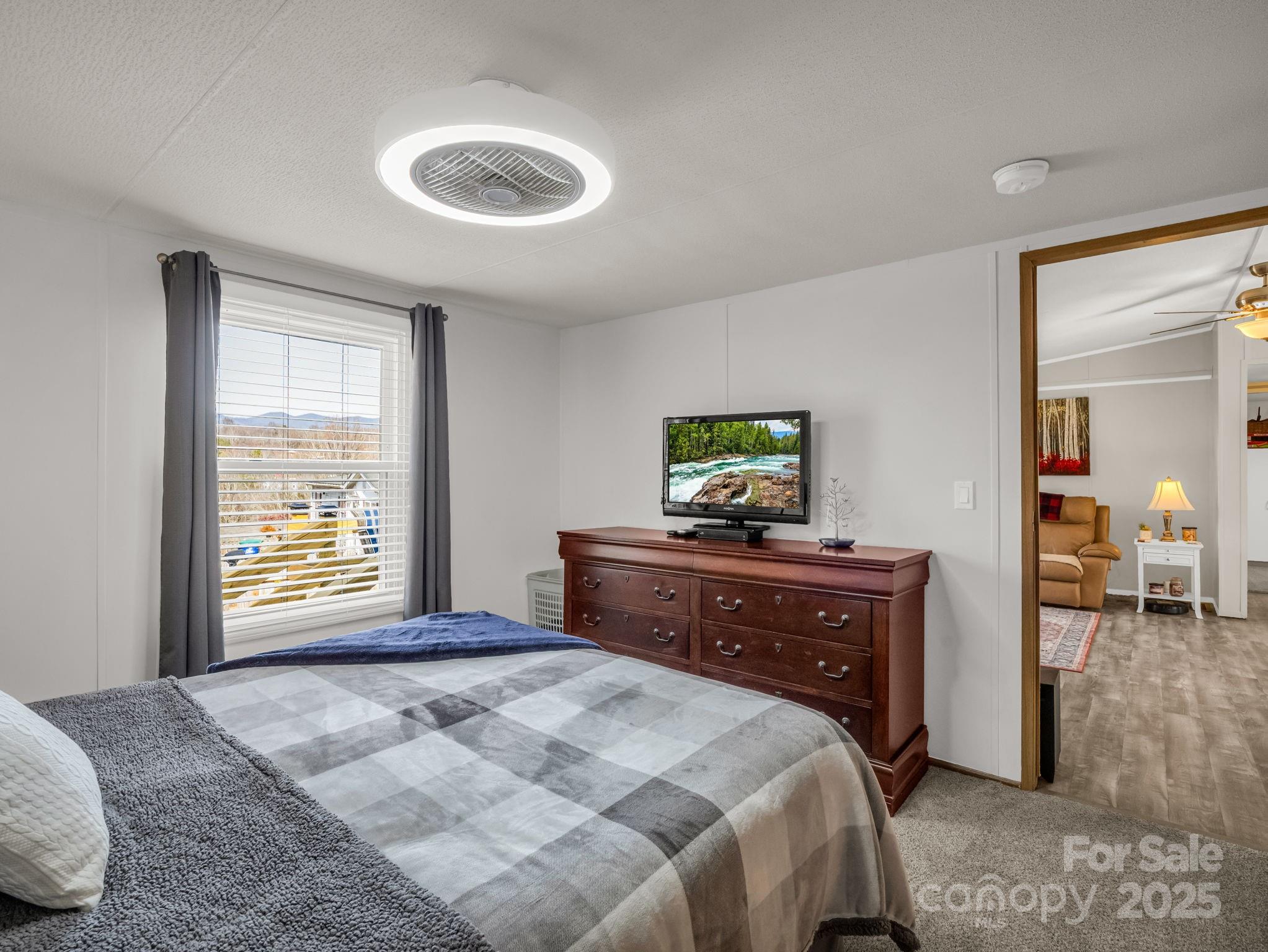 106 Hazy Day Swannanoa, NC 28778 - Photo 14 of 30 a bedroom with a bed and a dresser