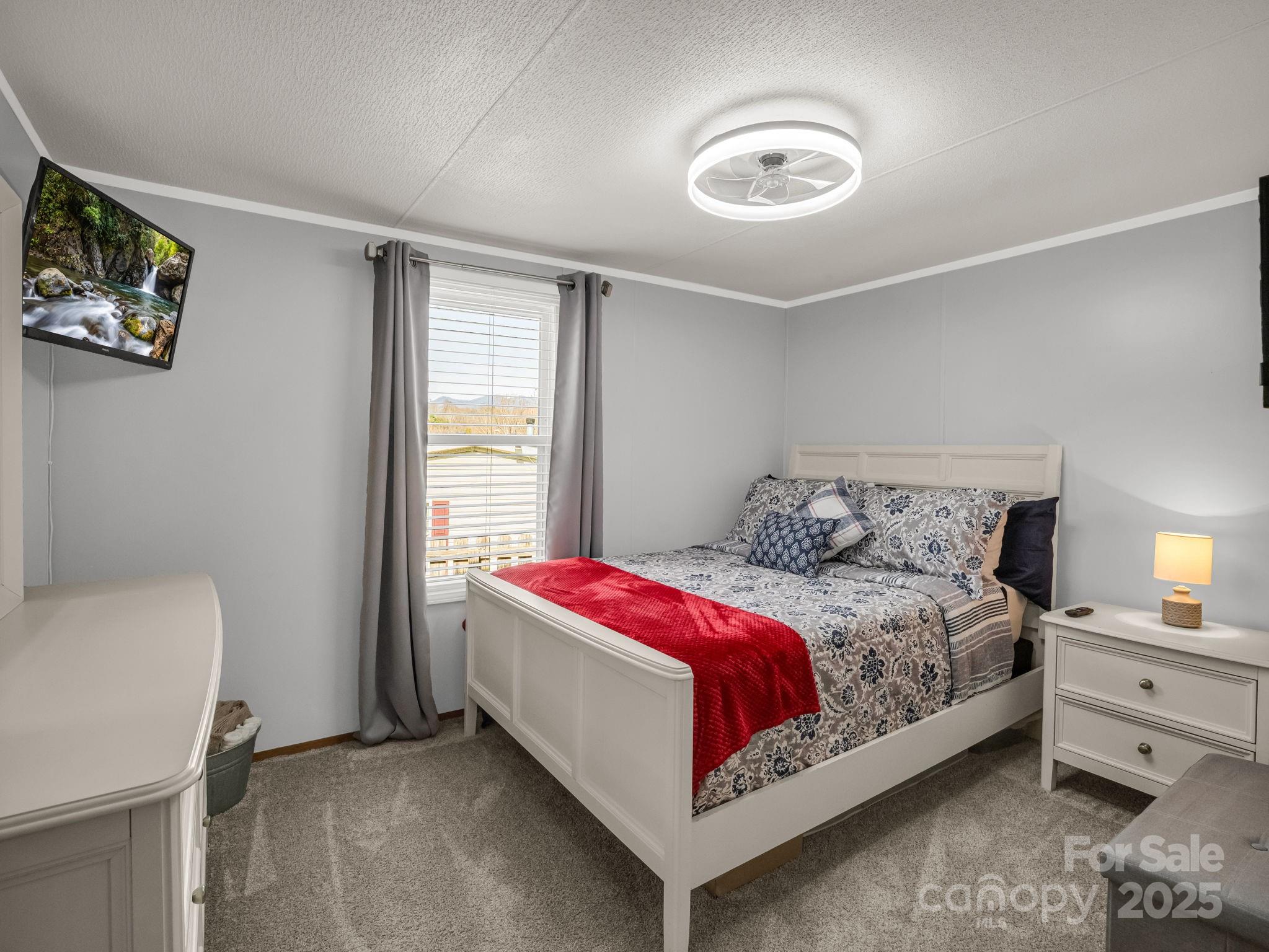 106 Hazy Day Swannanoa, NC 28778 - Photo 15 of 30 a bedroom with a bed and a window