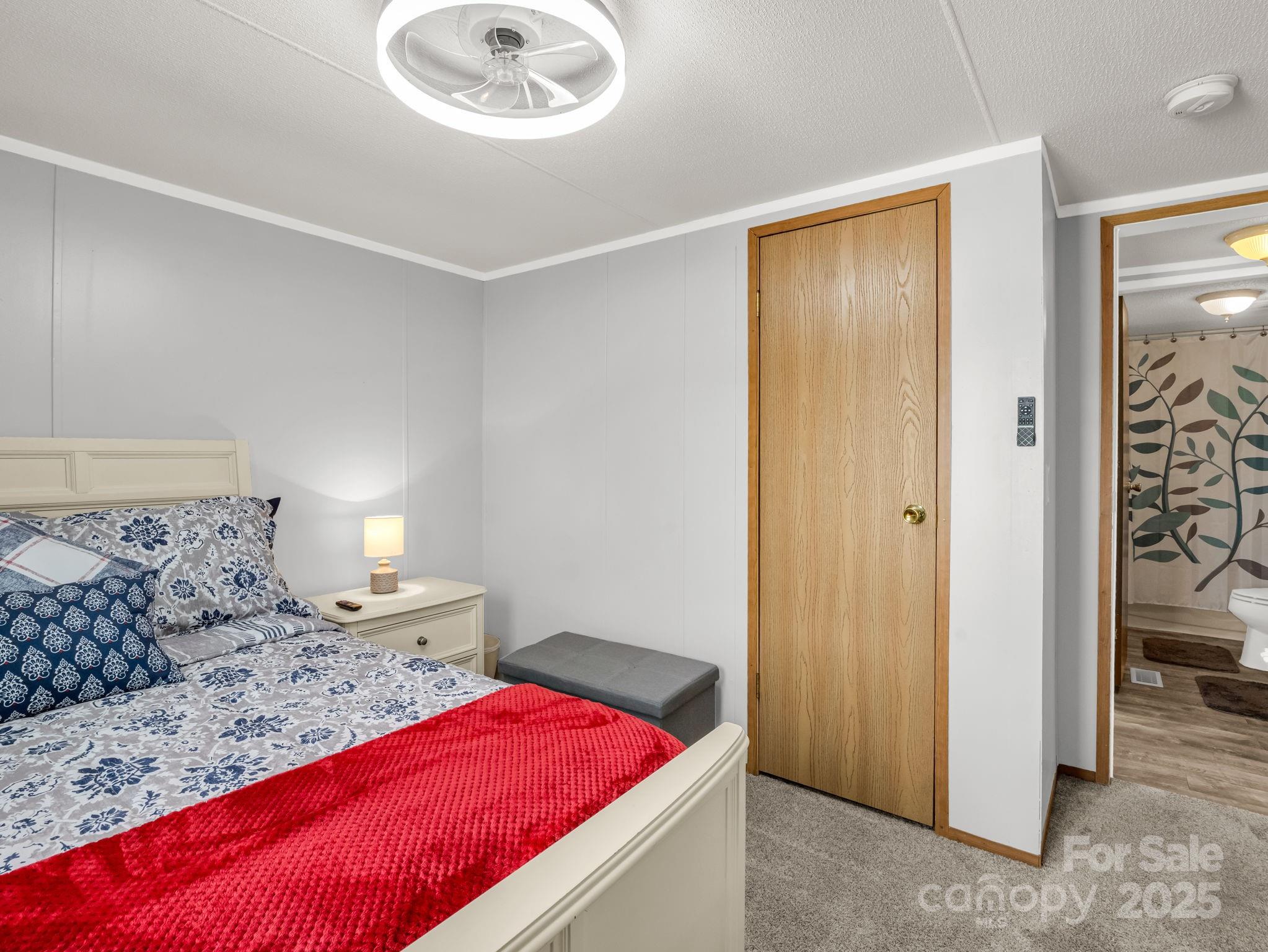 106 Hazy Day Swannanoa, NC 28778 - Photo 16 of 30 a bedroom with a bed and a cabinets