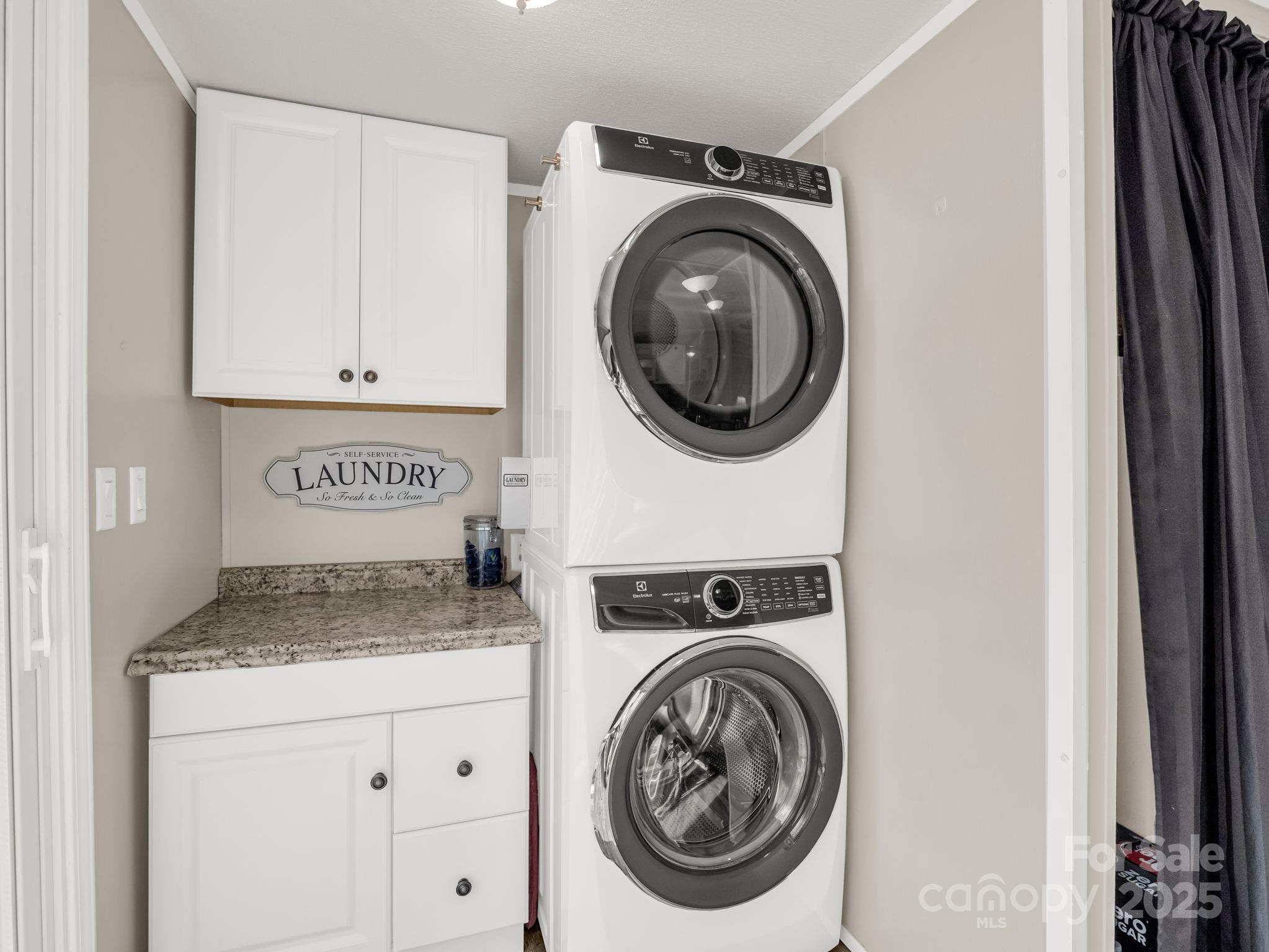 106 Hazy Day Swannanoa, NC 28778 - Photo 20 of 30 a view of a storage and utility room with washer and dryer