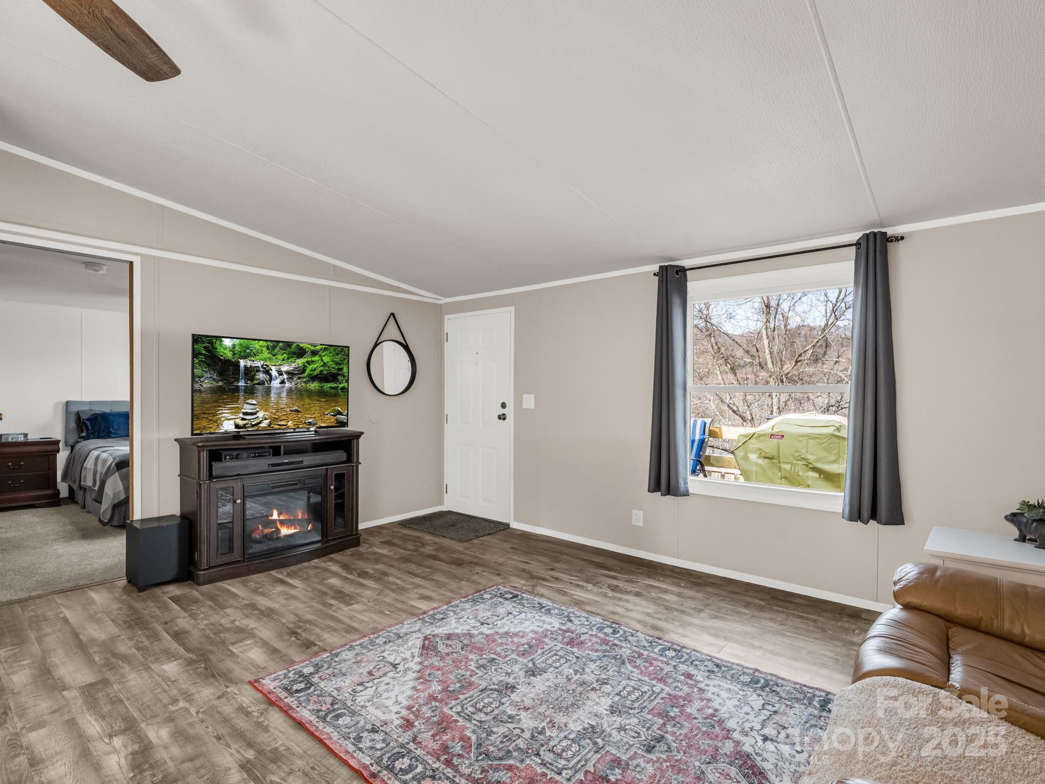 106 Hazy Day Swannanoa, NC 28778 - Photo 2 of 30 a living room with furniture window and flat screen tv