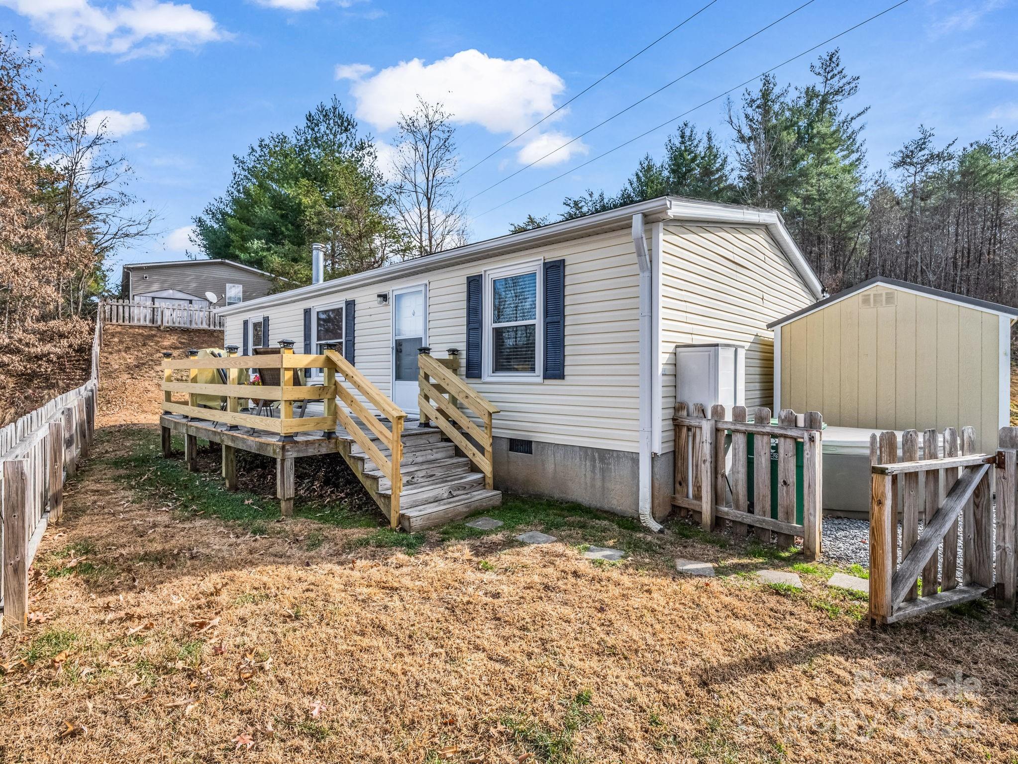 106 Hazy Day Swannanoa, NC 28778 - Photo 22 of 30 a front view of a house with a yard and seating space