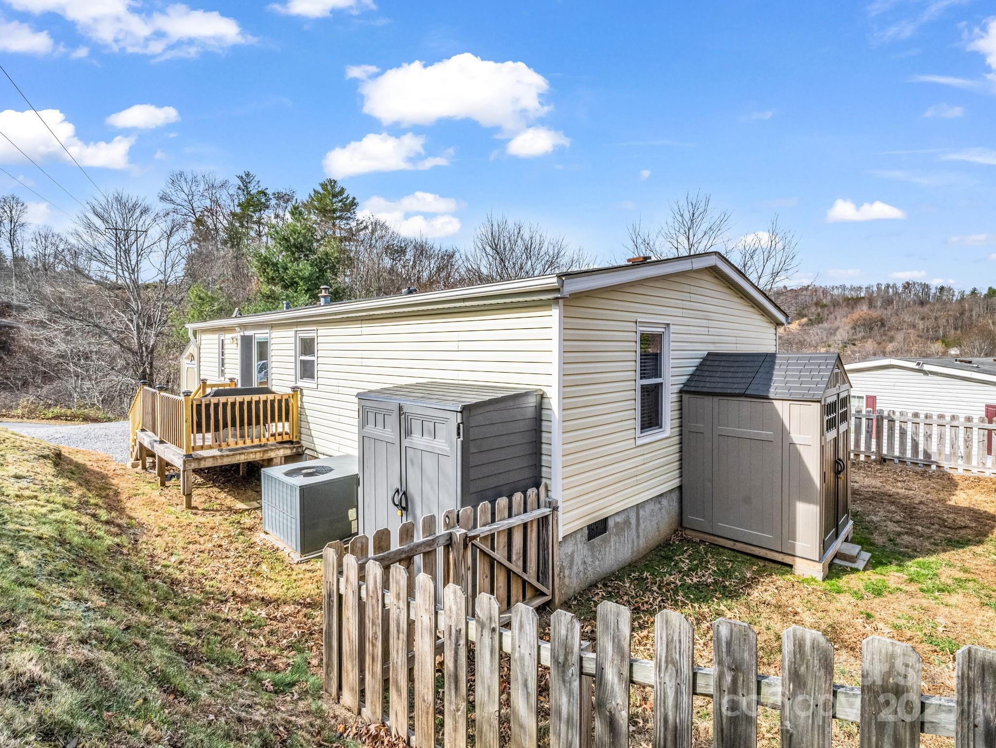 106 Hazy Day Swannanoa, NC 28778 - Photo 27 of 30 a view of a house with wooden fence