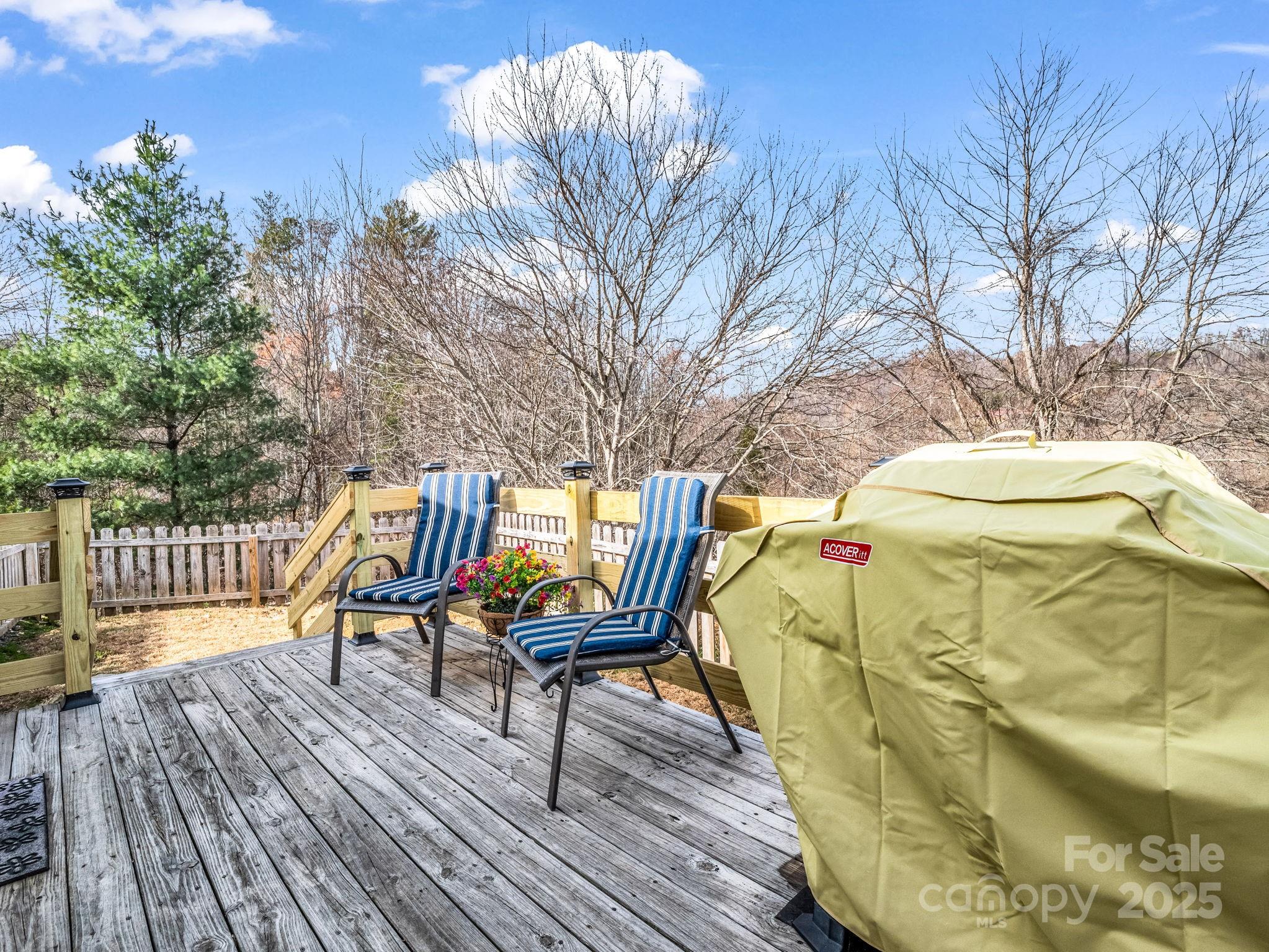 106 Hazy Day Swannanoa, NC 28778 - Photo 8 of 30 a roof deck with table and chairs and wooden floor