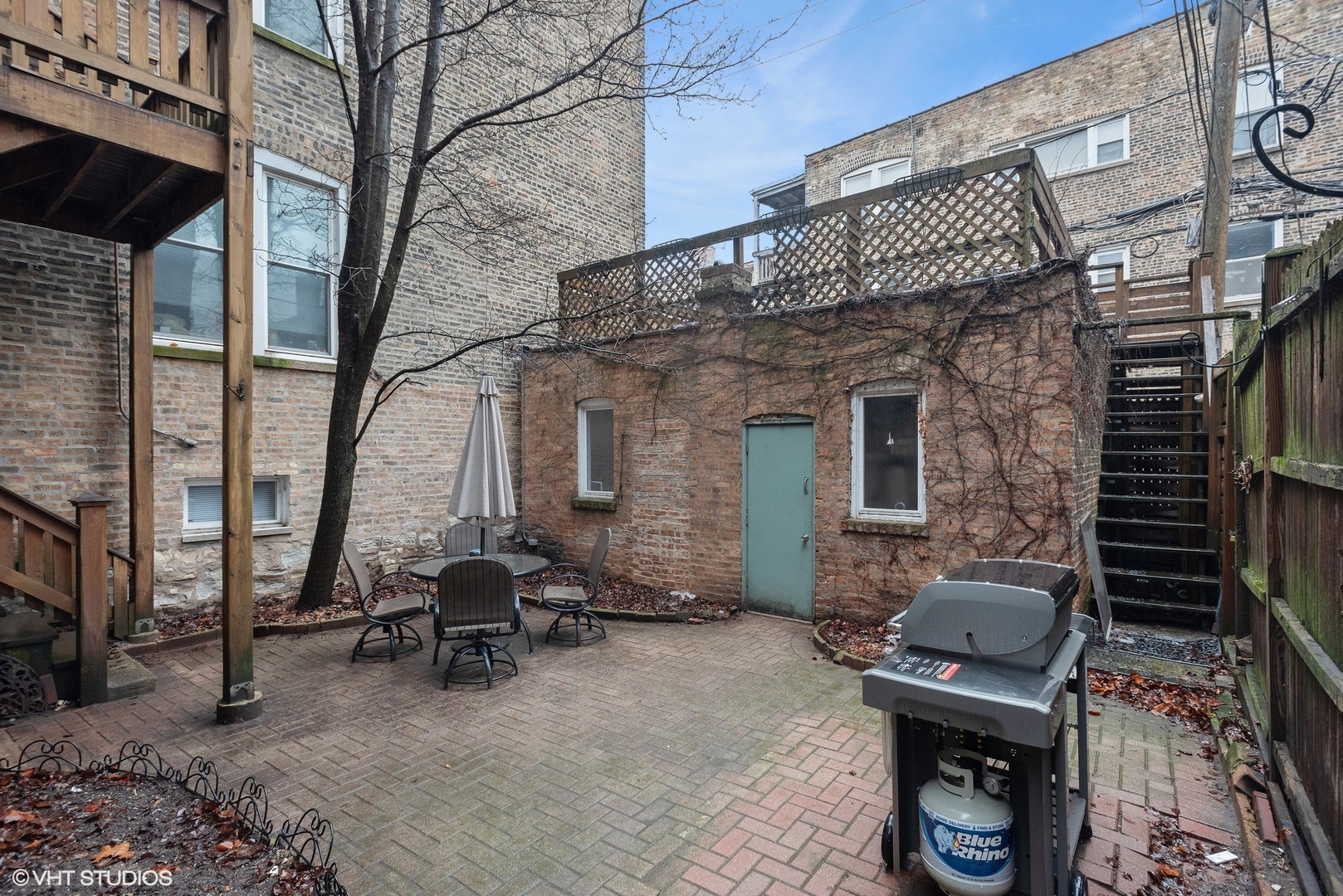 Undisclosed Address Chicago, IL 60657 - Photo 13 of 13 a view of a patio with a table and chairs