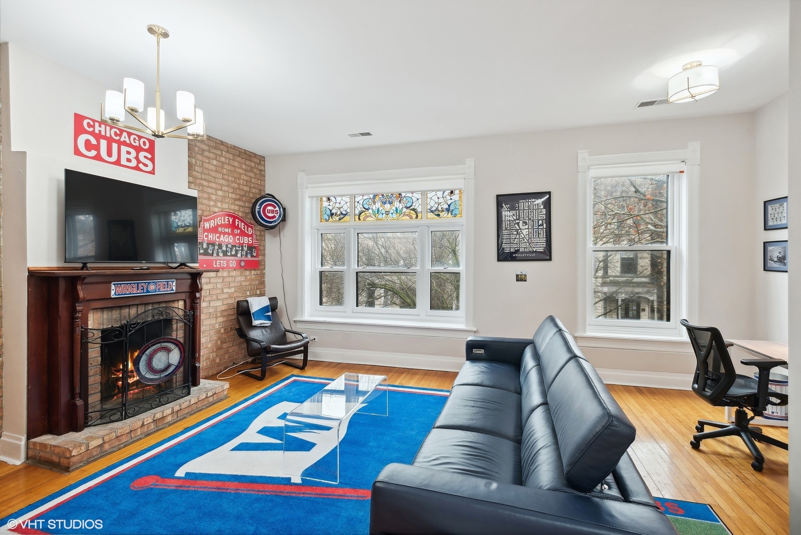 Undisclosed Address Chicago, IL 60657 - Photo 2 of 13 a living room with furniture and a flat screen tv