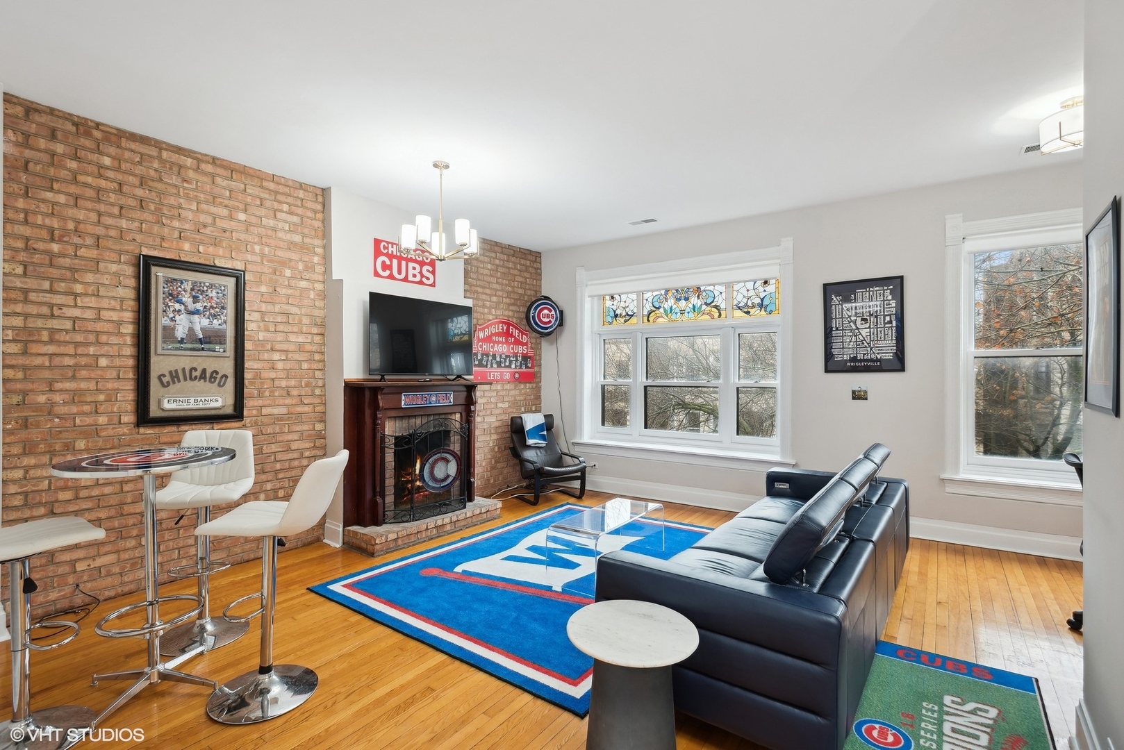Undisclosed Address Chicago, IL 60657 - Photo 3 of 13 a living room with fireplace furniture and a flat screen tv