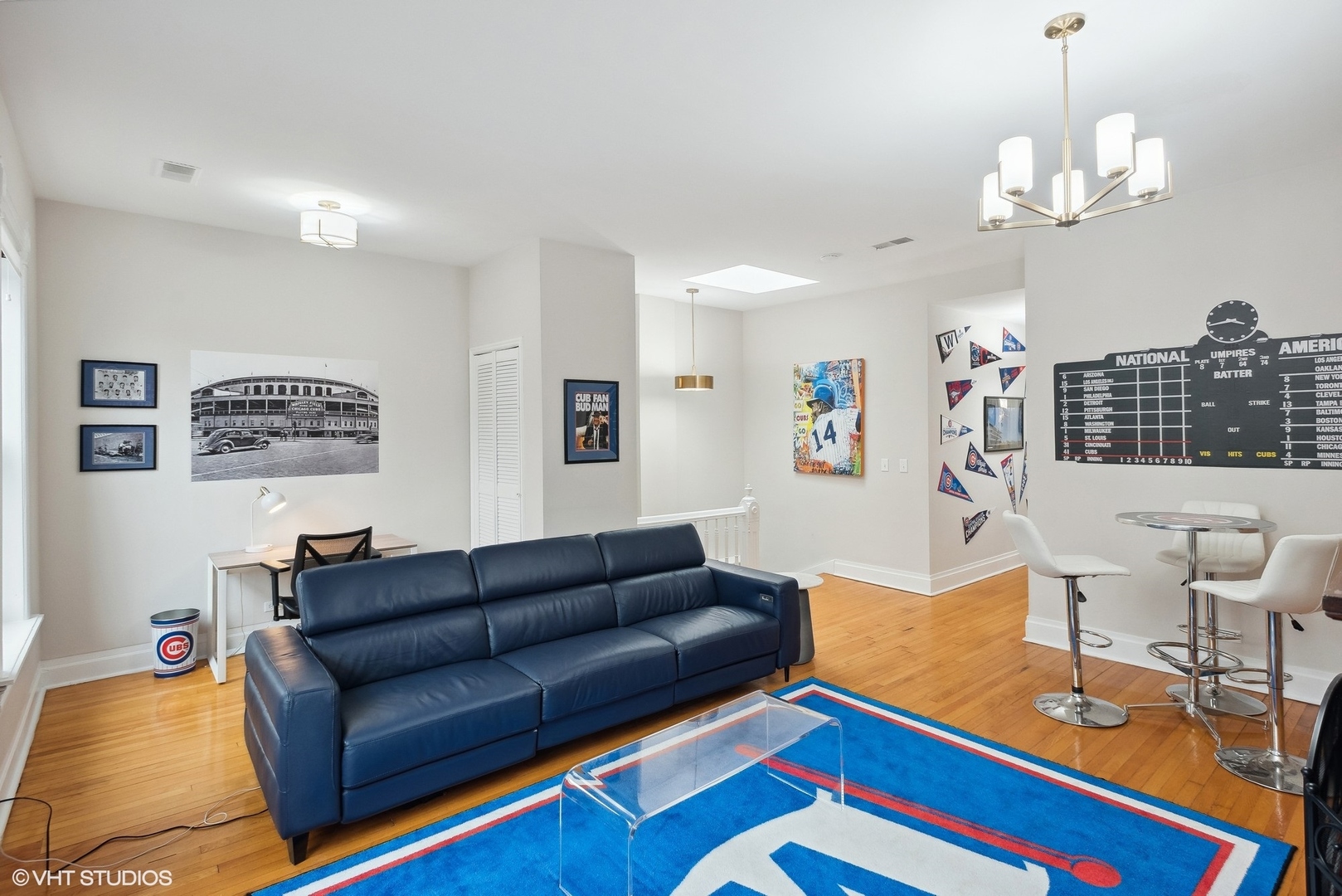 Undisclosed Address Chicago, IL 60657 - Photo 4 of 13 a living room with furniture a chandelier and a dining table