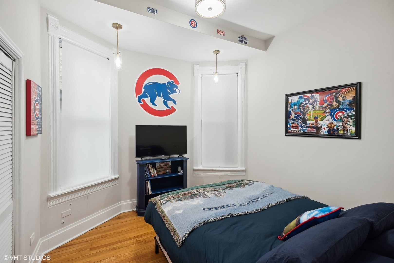 Undisclosed Address Chicago, IL 60657 - Photo 6 of 13 a bedroom with a bed and a flat screen tv