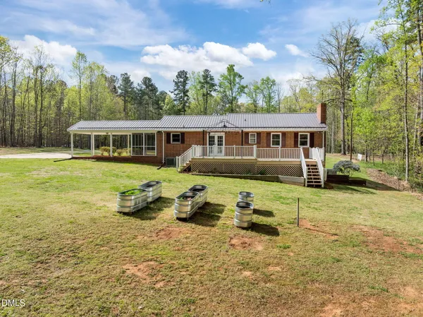 a view of empty room with wooden floor and ceiling fan
