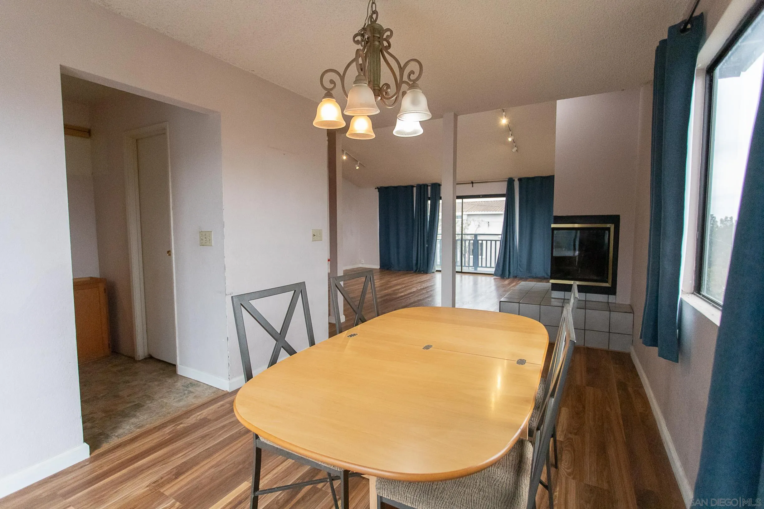 9802 Eucalyptus Street Spring Valley, CA 91977 - Photo 12 of 40 a view of a dining room with furniture and wooden floor
