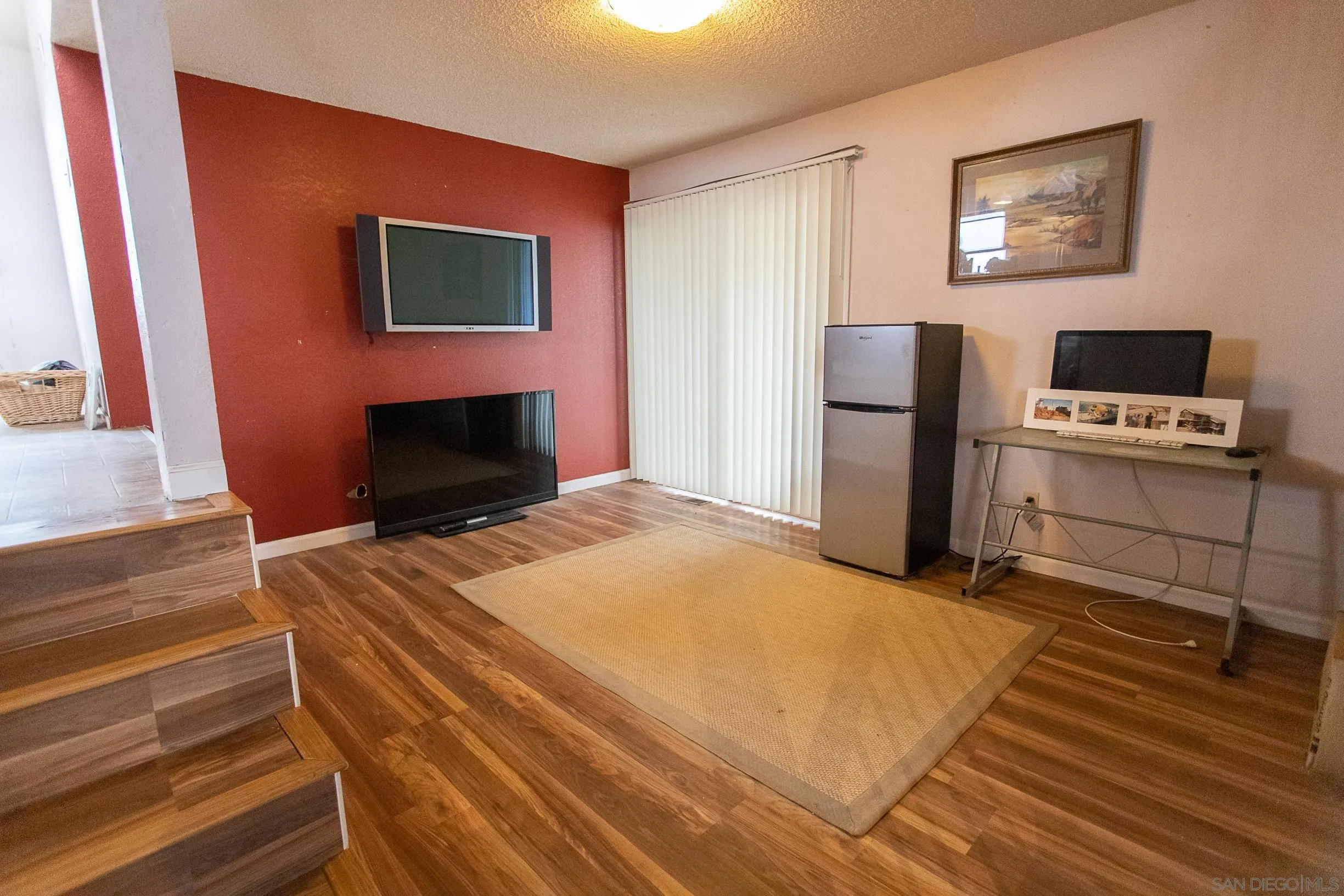 9802 Eucalyptus Street Spring Valley, CA 91977 - Photo 14 of 40 a bedroom with a bed and a flat screen tv