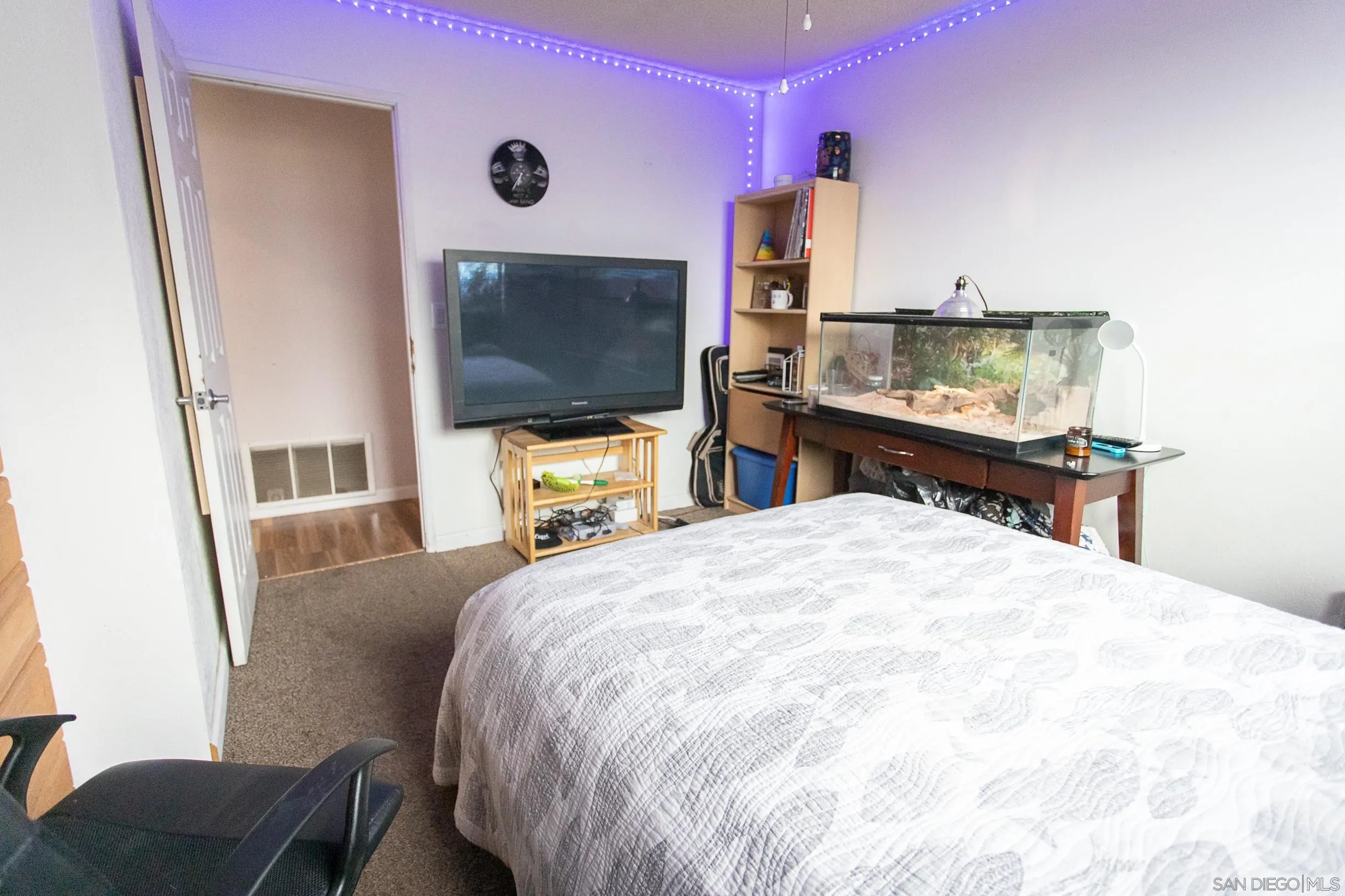 9802 Eucalyptus Street Spring Valley, CA 91977 - Photo 16 of 40 a bedroom with a bed and a flat screen tv