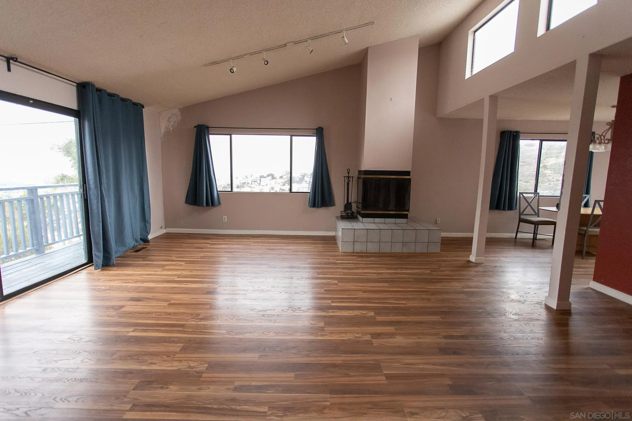9802 Eucalyptus Street Spring Valley, CA 91977 - Photo 2 of 40 a view of a livingroom with wooden floor and a fireplace