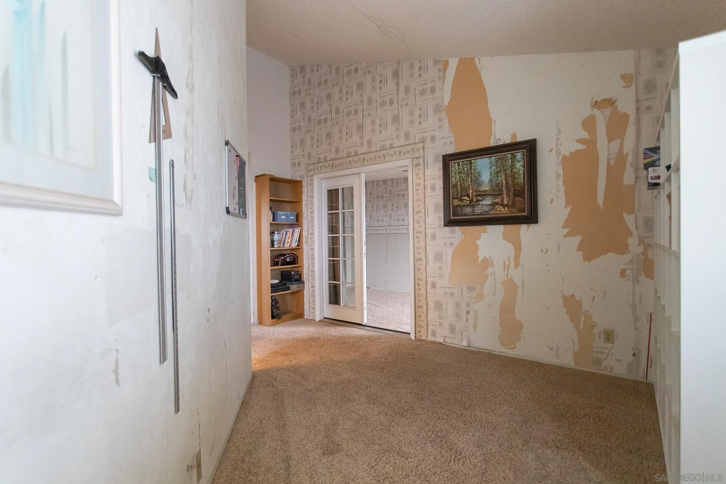 9802 Eucalyptus Street Spring Valley, CA 91977 - Photo 25 of 40 a view of a livingroom with wooden floor and a flat screen tv