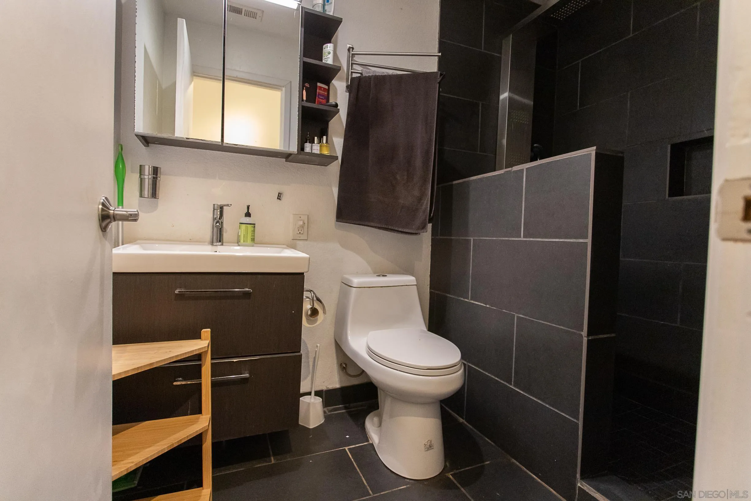 9802 Eucalyptus Street Spring Valley, CA 91977 - Photo 33 of 40 a bathroom with a sink toilet and shower