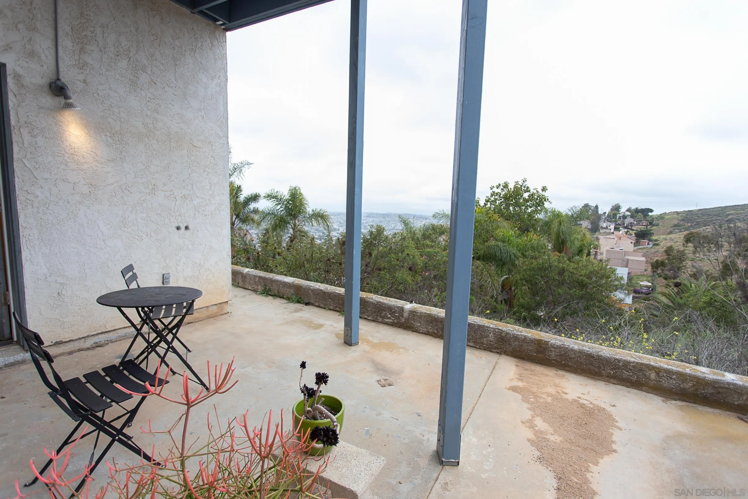 9802 Eucalyptus Street Spring Valley, CA 91977 - Photo 34 of 40 a view of a workspace with a table and chairs in patio