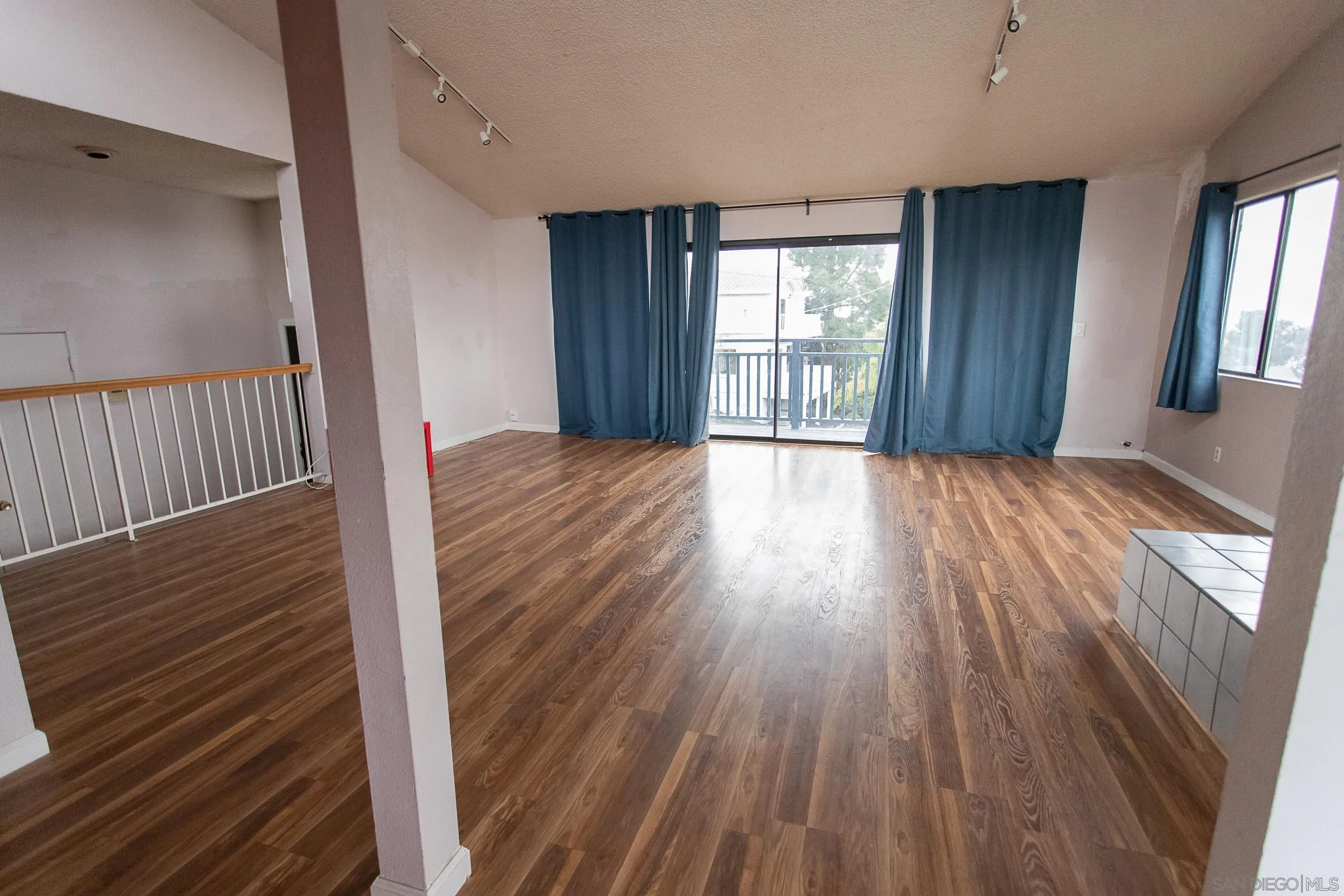9802 Eucalyptus Street Spring Valley, CA 91977 - Photo 5 of 40 a view of wooden floor and windows in a room
