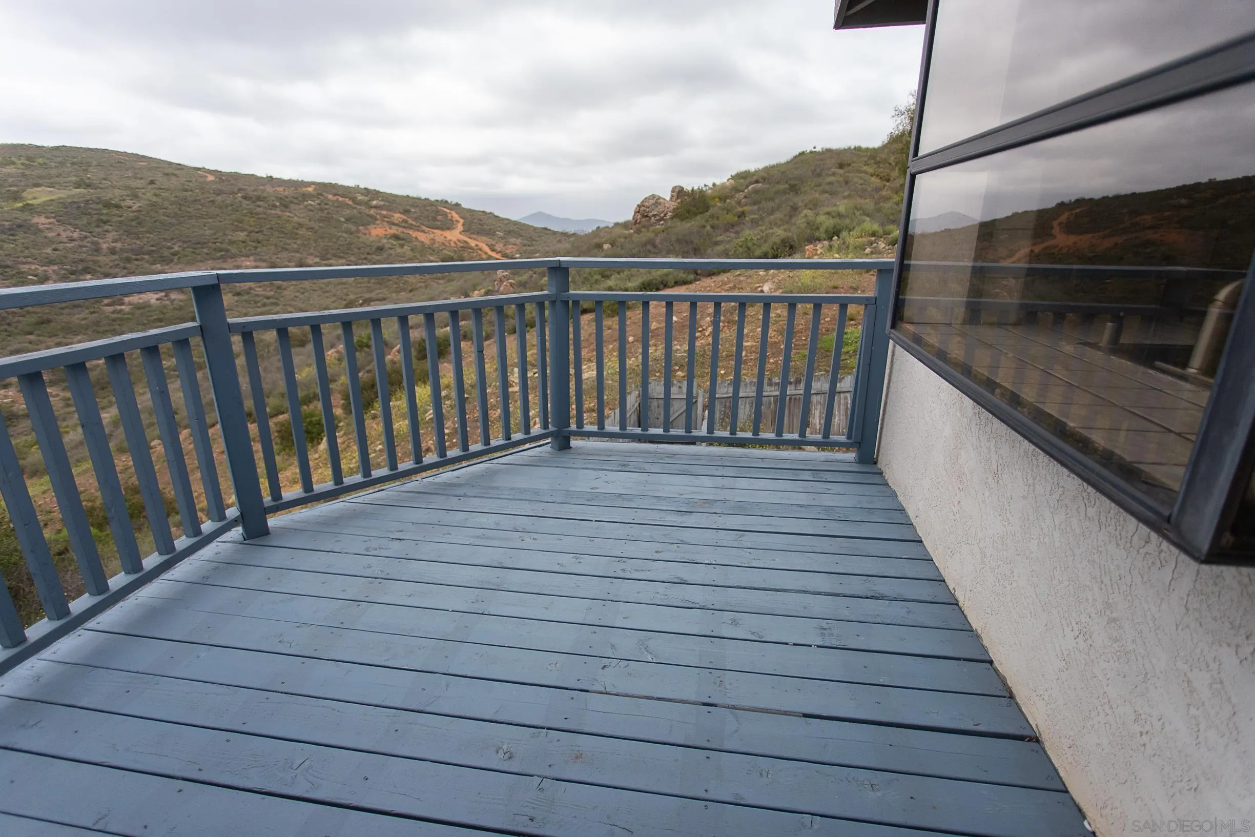 9802 Eucalyptus Street Spring Valley, CA 91977 - Photo 9 of 40 a view of balcony with wooden floor and fence